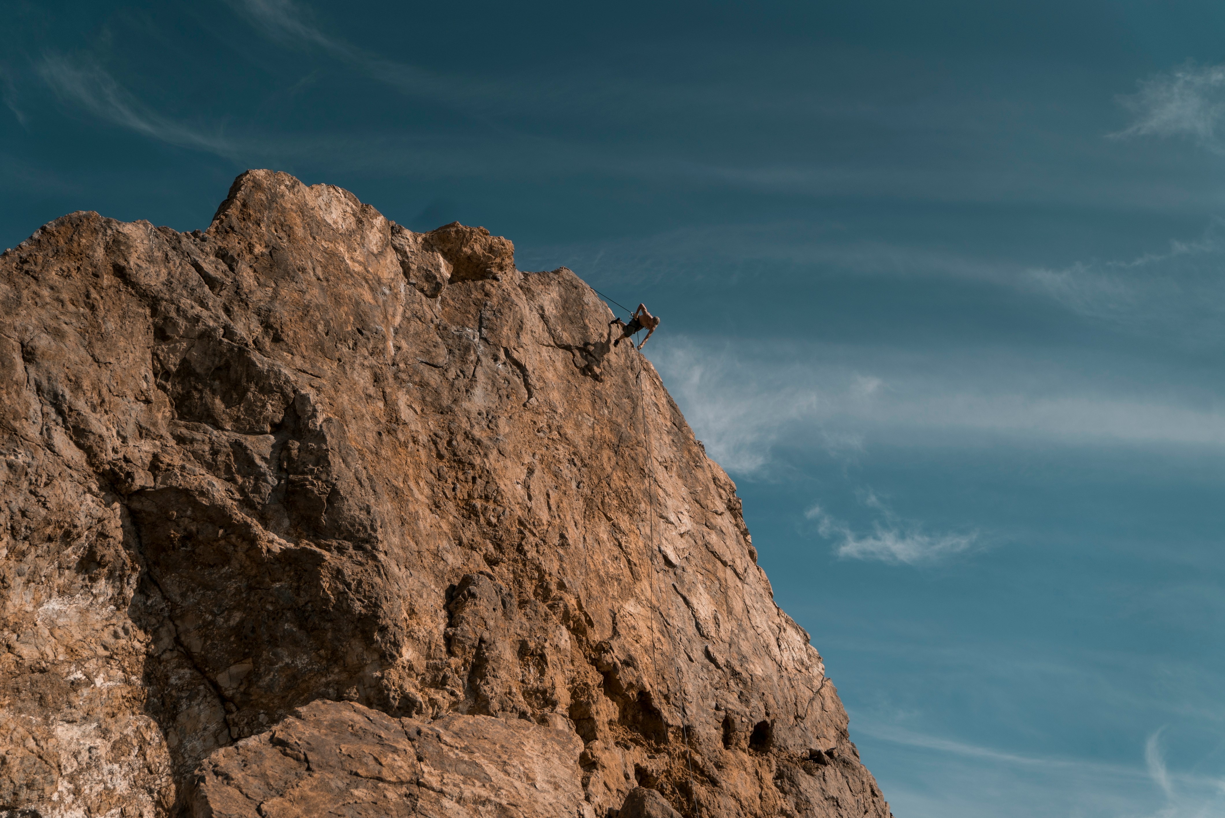 person on brown mountain